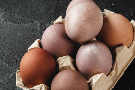 Traditional Christian eastertime, painted eggs in egg box.