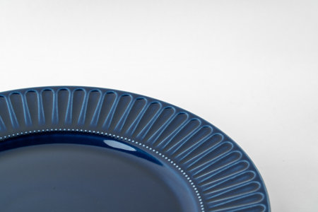 Glossy new ceramic dishware on paper background