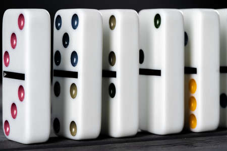 Domino game. Dominoes on a black table