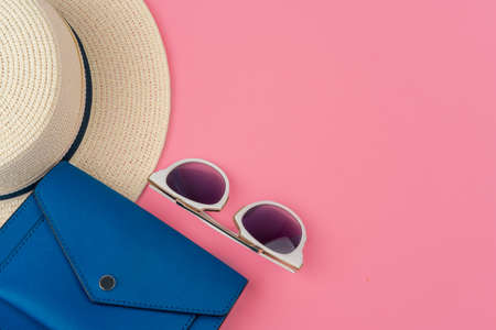 Female straw hat and sunglasses for beach holiday top view
