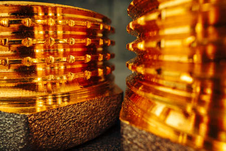 Metal golden water pipe fitting piece macroの写真素材