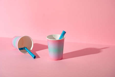 Female disposable razor in a cup, studio shotの写真素材