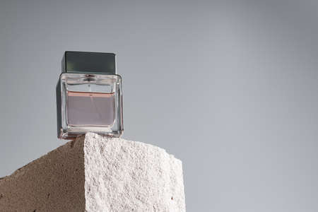 Transparent fragrance bottle on gray backgroundの写真素材