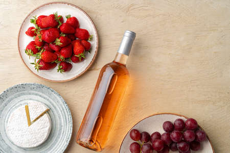 Composition of cheese, and fruits on gray tableの写真素材