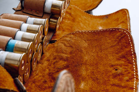 Pouch full of rifle cartridges on black backgorundの写真素材