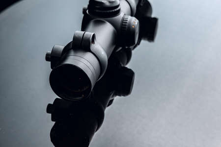 Black rifle optical sight on black backgroundの写真素材