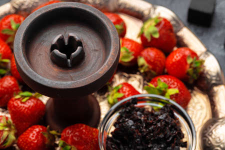 Empty hookah shaft close up on table with fresh fruitの写真素材