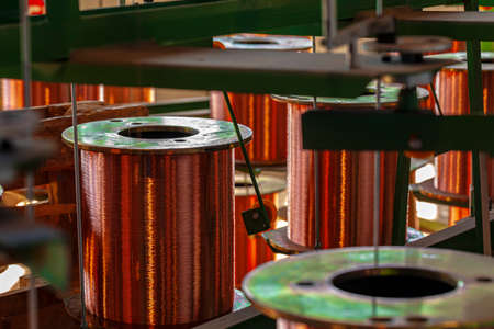 Copper wire reels in cable factory close upの写真素材