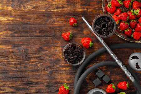 Hookah parts and strawberry on gray surface close upの写真素材