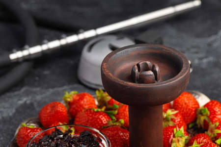 Empty hookah shaft close up on table with fresh fruitの写真素材