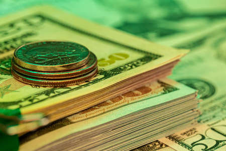 American dollar banknotes and coins on black backgroundの写真素材