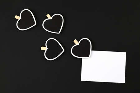 Wooden pegs in the form of wooden heart on colored backgroundの写真素材