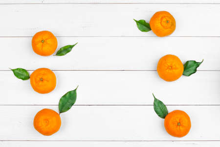tangerines on a black wooden background, space for textの写真素材