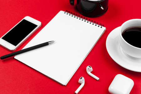 Mock up with copy space with smartphone on bright red backgroundの写真素材