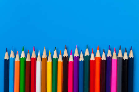 background from color pencils on blue paper