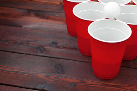 Cups for game Beer Pong on the tableの写真素材