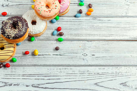 Glazed donuts on wooden backgroundの写真素材