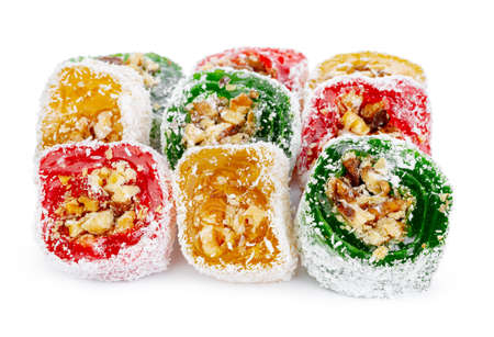 Colorful Turkish delight with nuts in powdered sugar isolated on whiteの写真素材