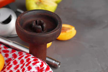Hookah pipe and shaft with fruits on gray backgroundの写真素材
