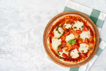 Top view of pizza Margherita on gray surfaceの写真素材