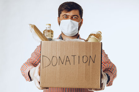 Donation box of food for people suffering from coronavirus pandemiaの写真素材