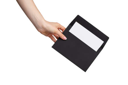 Female hand with manicure holding envelope isolated on white