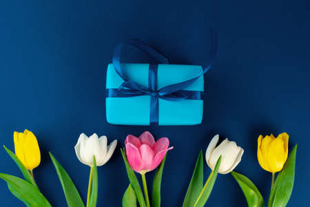 Fresh flowers and gift box with ribbonの写真素材