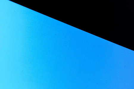 Blank carton paper sheets background in dark blue lightの写真素材