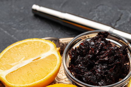 Shisha parts, tobacco and lemons close up