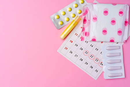 Calendar page with female menstrual hygienic itemsの写真素材