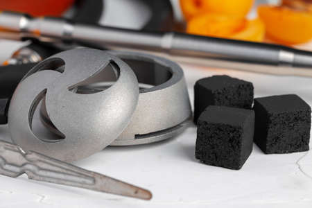 Hookah parts with fresh apricots on tableの写真素材