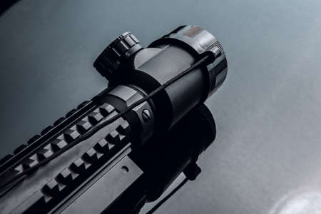 Black rifle optical sight on black backgroundの写真素材