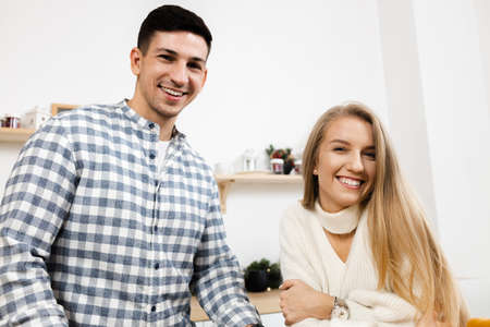 Portrait of a young sweet couple in kitchen