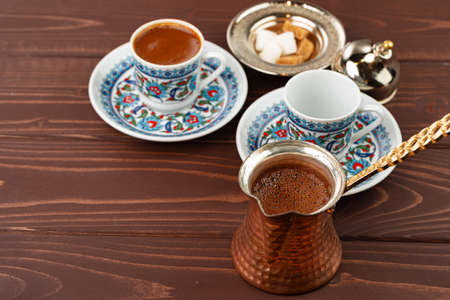 Traditional turkish coffee in oriental dishware close upの写真素材