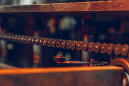 Metal chain of conveyor belt on production line on cable factory