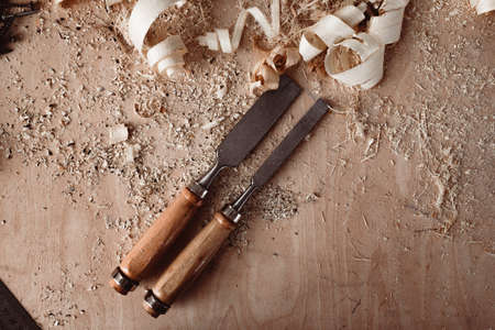 Carpenters chisel, woodwork tool on the desktop in the workshopの写真素材