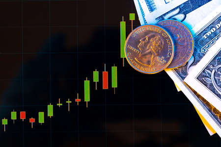 American dollar banknotes and graph on black background