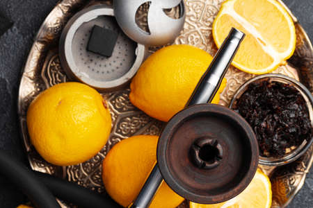 Empty hookah shaft close up on table with fresh fruitの写真素材