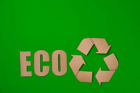 Paper recycling concept on green background top viewの写真素材