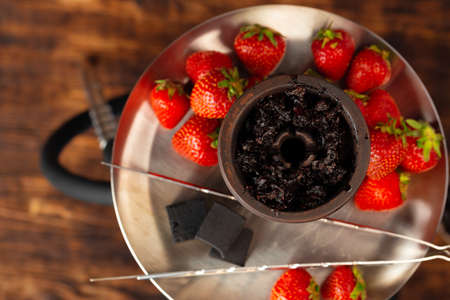 Hookah with strawberry flavour close up on dark backgroundの写真素材