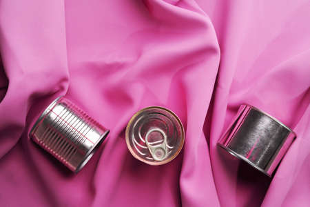 Tin can on pink silky fabric, aesthetic conceptの写真素材