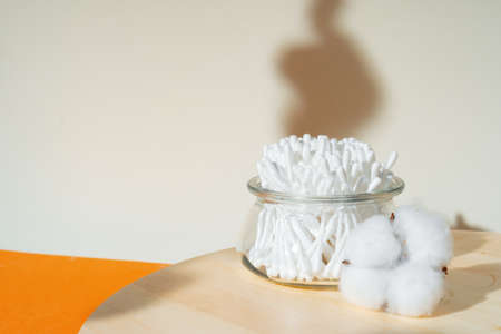 Hygienic cotton ear buds in glass cupの写真素材