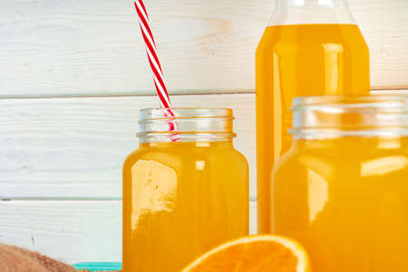 Close up of orange juice glass on wooden tableの写真素材