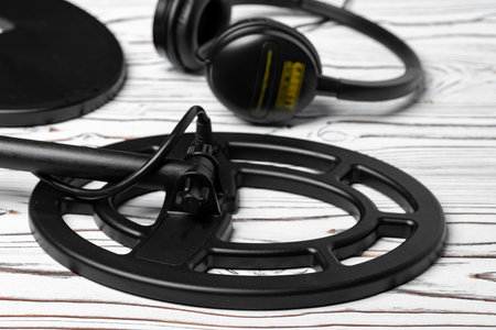 Accessories for metal detector on wooden backgroundの写真素材