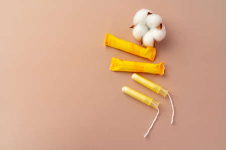 Female hygienic tampons on paper background close upの写真素材