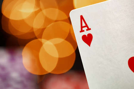 Playing cards against bokeh background close upの写真素材