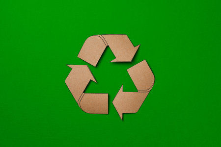 Paper recycling concept on green background top viewの写真素材
