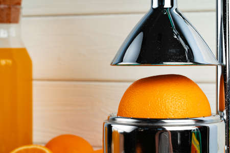 Metal hand orange juice squeezer close upの写真素材