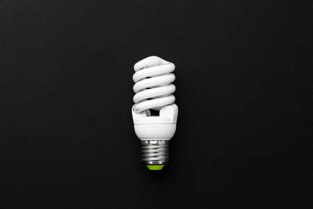 One light bulb on black background top viewの写真素材