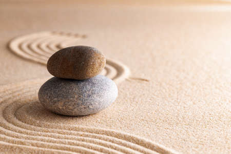 Japanese zen garden with stone in raked sand